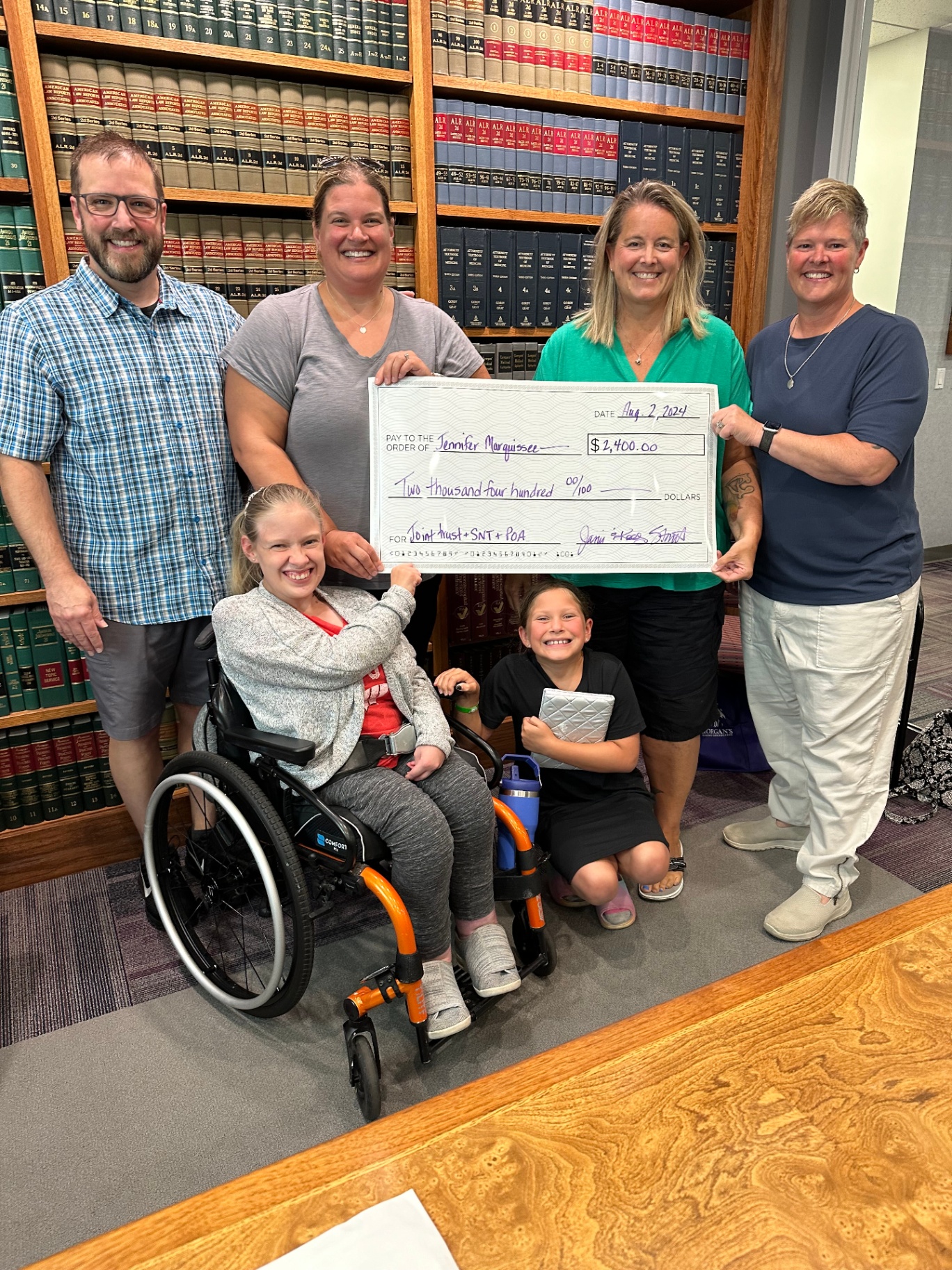 The Marquissee family receiving a Family Support Giving Fund grant check