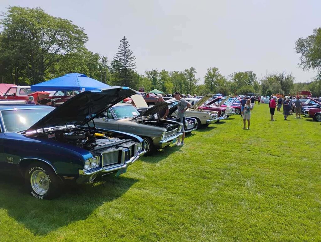 Classic cars on display at a community Care Car Show fundraiser supporting MCC special needs families