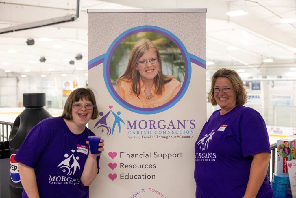 Volunteer with a person with Down syndrome representing Morgan's legacy